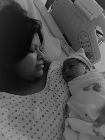 mom holding baby in hospital